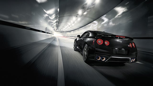 2023 Nissan GT-R seen from behind driving through a tunnel | King Windward Nissan in Kaneohe HI